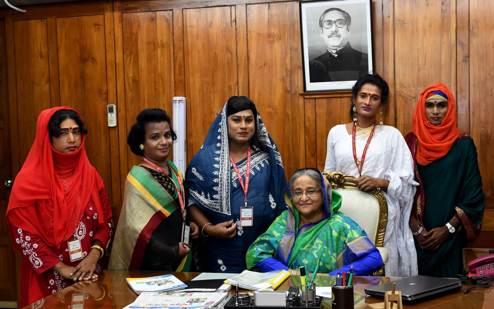 A delegation seated with Prime Minister Sheikh Hasina in a formal office.