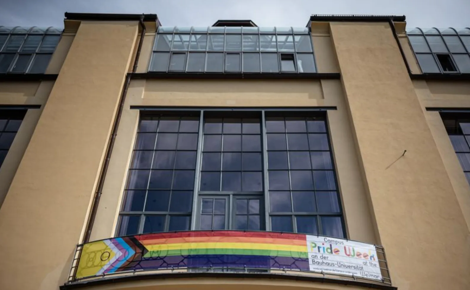 Intersex-Inclusive Progress Pride Flag hoisted on the central balcony of the Main Building during Campus Pride Week, Bauhaus-Universität Weimar, June 2022