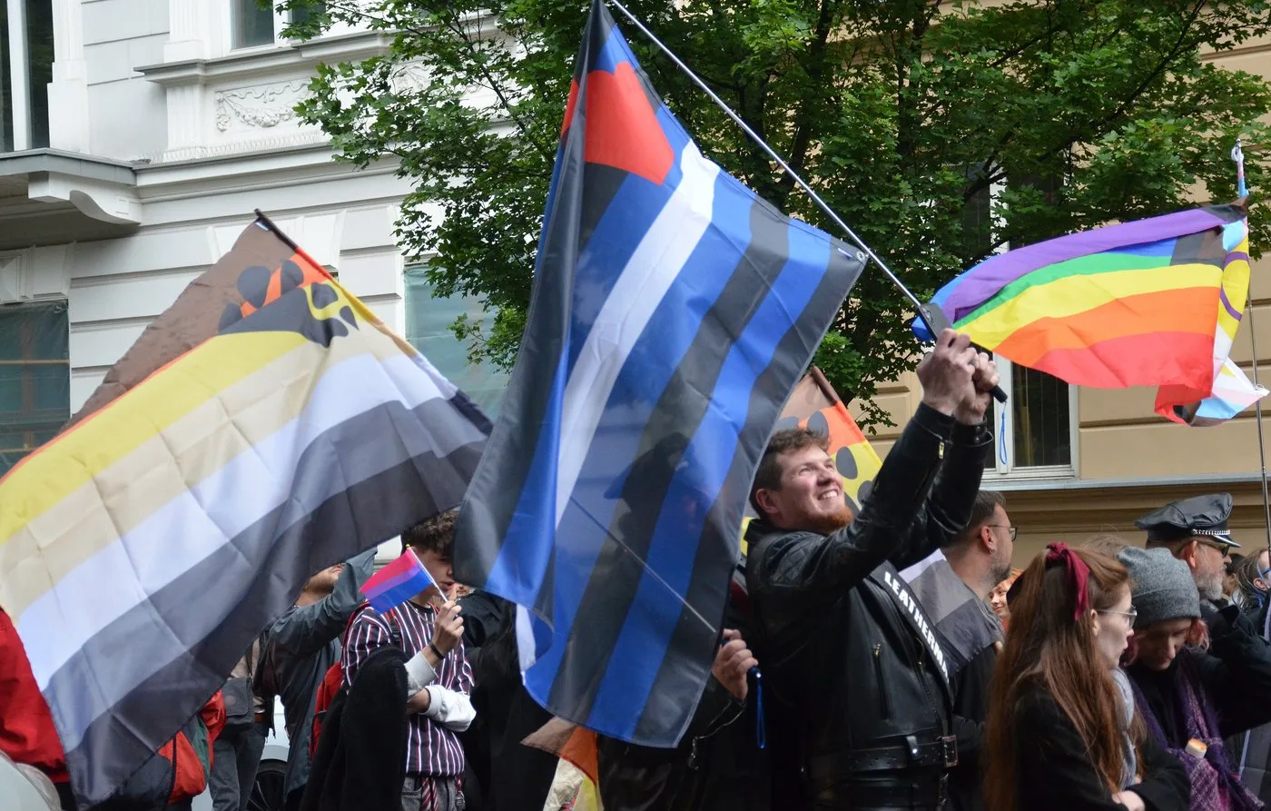 Leather pride flag carried among the crowd at the Equality March in Kraków, Poland, May 2025.