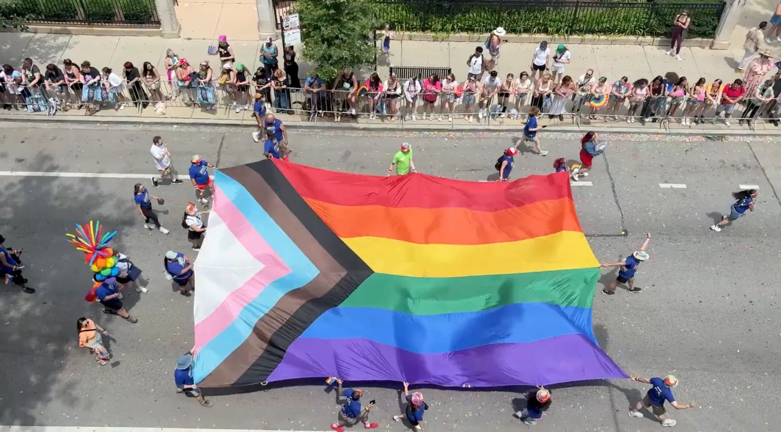 Aerial view of a massive Progress Pride flag at the Chicago Pride Parade, 2026