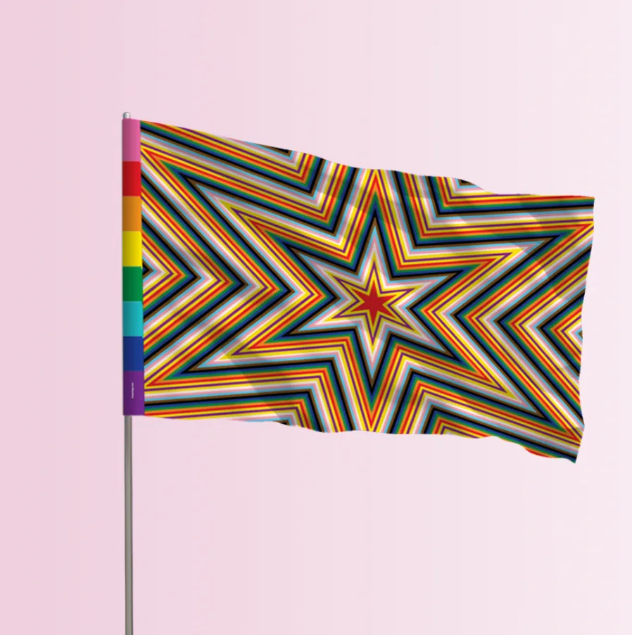 The NEW Chicago Pride Flag on a flagpole against a pink background, its concentric star pattern and hoist rainbow bar visible.