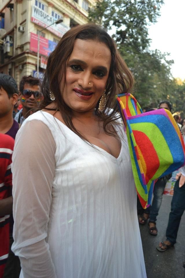 Laxmi Narayan Tripathi, in a red sari, photographed at an event.