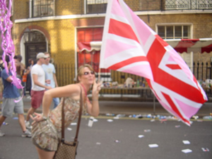 A woman waving a large Pink Jack on a London street during EuroPride 2006.