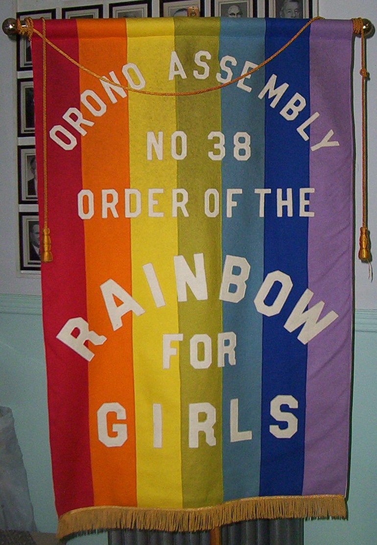 A vintage felt assembly banner of Orono Assembly No. 38, Order of the Rainbow for Girls, with seven vertical stripes including two blues and no turquoise.