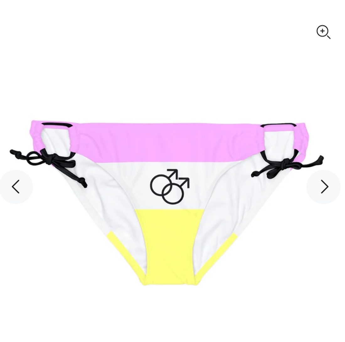 Tie-side bikini bottoms printed in the flag's stripes, pale pink across the waist, white through the middle carrying the interlocking male symbols, and pale yellow at the base.