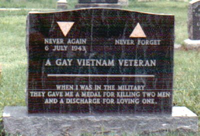 An earlier photograph of the Matlovich headstone: black granite with two pink triangles, 'Never Again 6 July 1943 — Never Forget,' 'A Gay Vietnam Veteran,' and the epitaph.