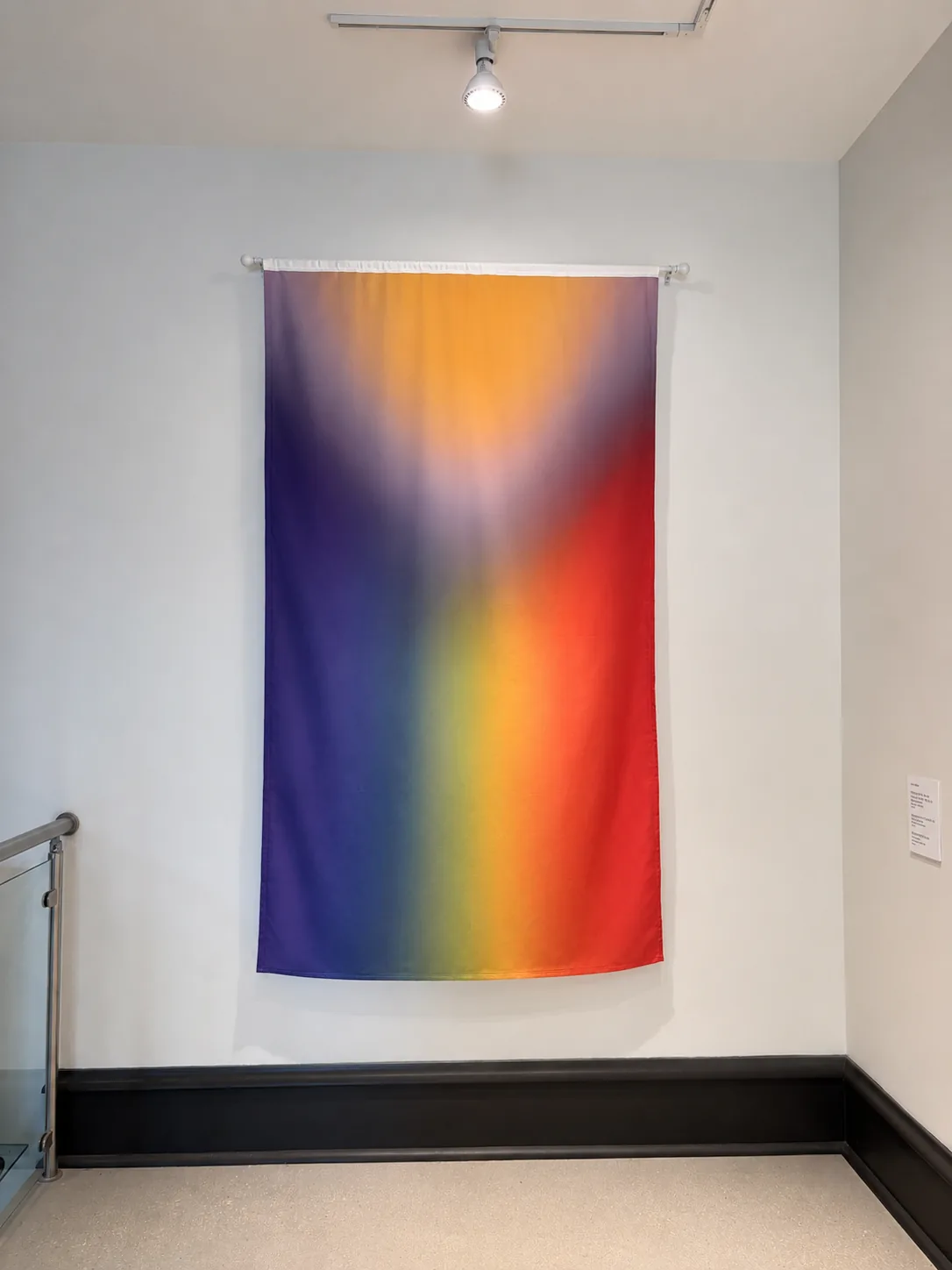 Right to Assemble — close view of a soft gradient rainbow flag
